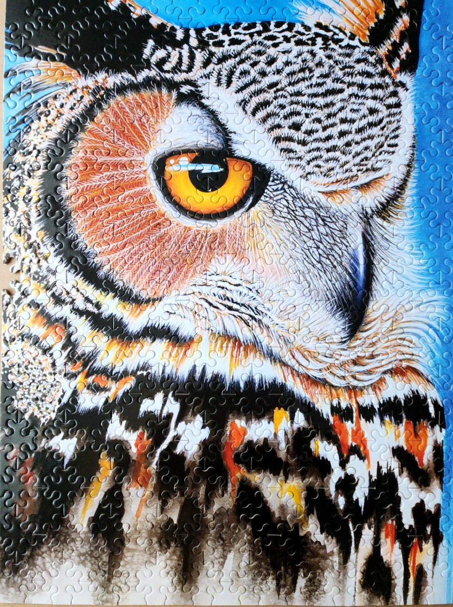 A close-up artistic portrait of a great horned owl