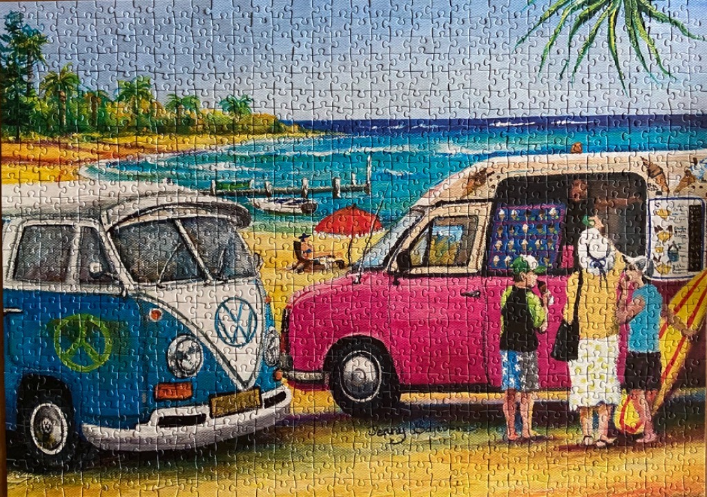 A sunny beach scene with a blue vintage van and a pink ice cream truck with customers nearby.