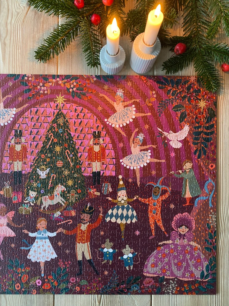 Festive Nutcracker-themed illustration with ballet dancers, a decorated Christmas tree, and magical holiday characters.