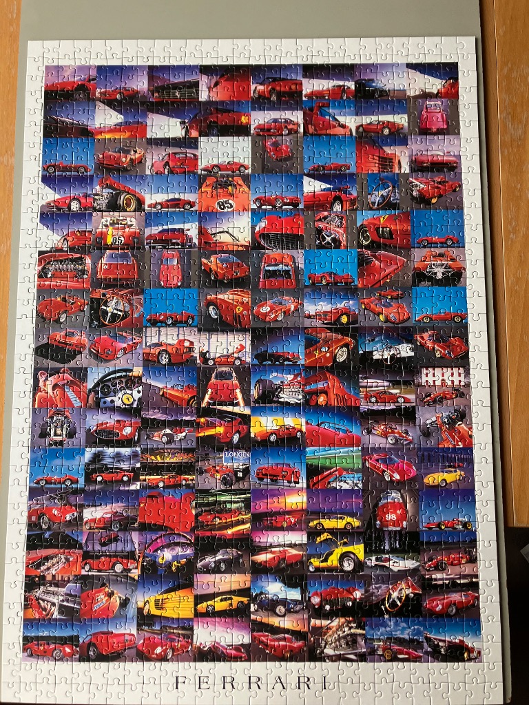 A montage of various red Ferrari sports cars and race cars arranged in a grid pattern.