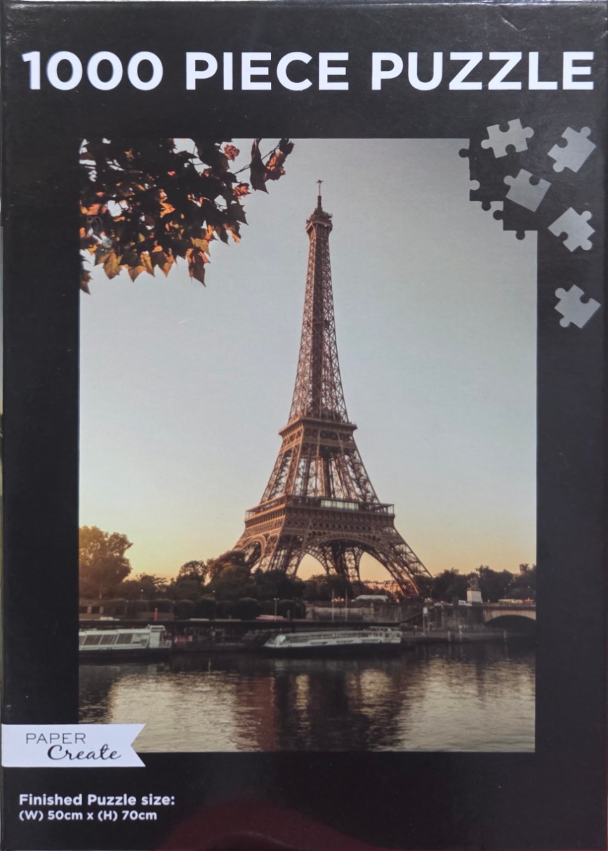 Eiffel Tower in Paris at sunset reflected in the Seine River
