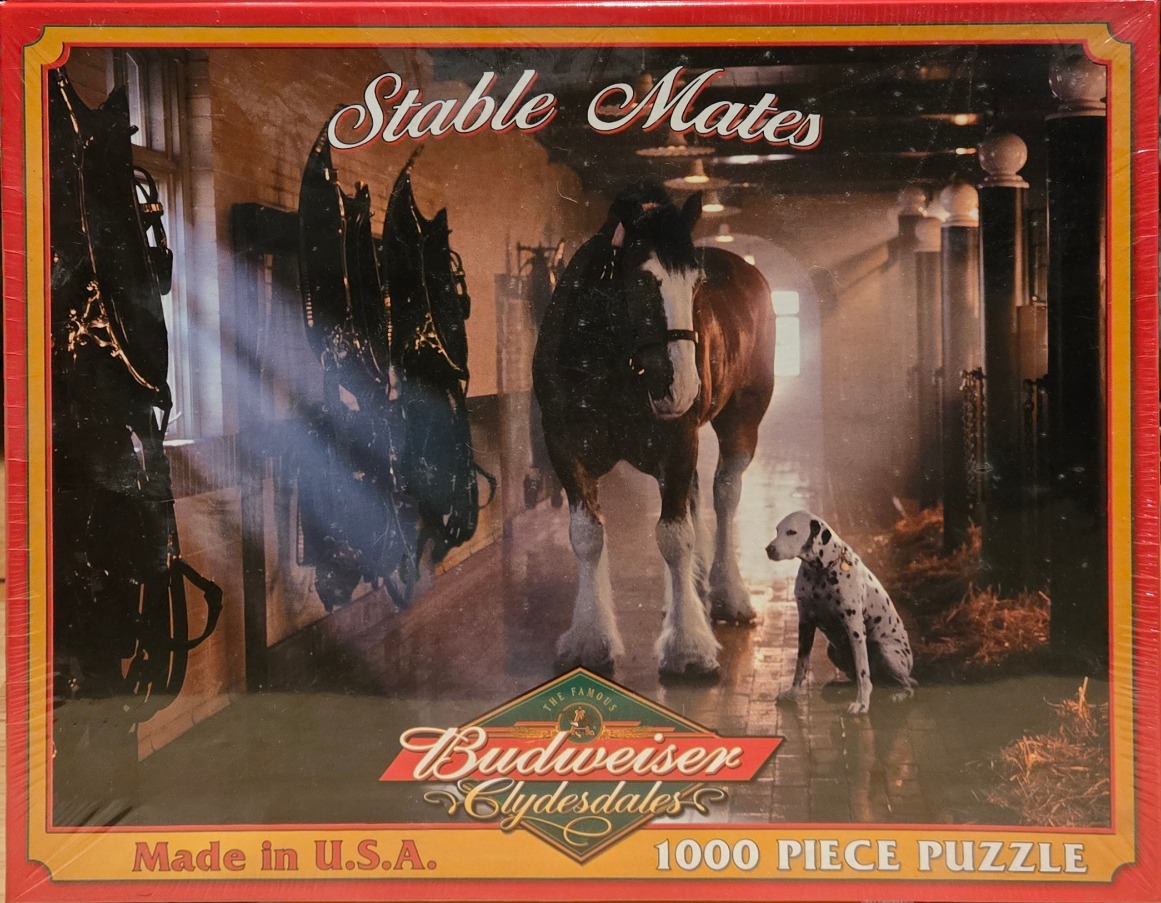 A Clydesdale horse and a Dalmatian dog standing in a rustic, sunlit stable aisle.
