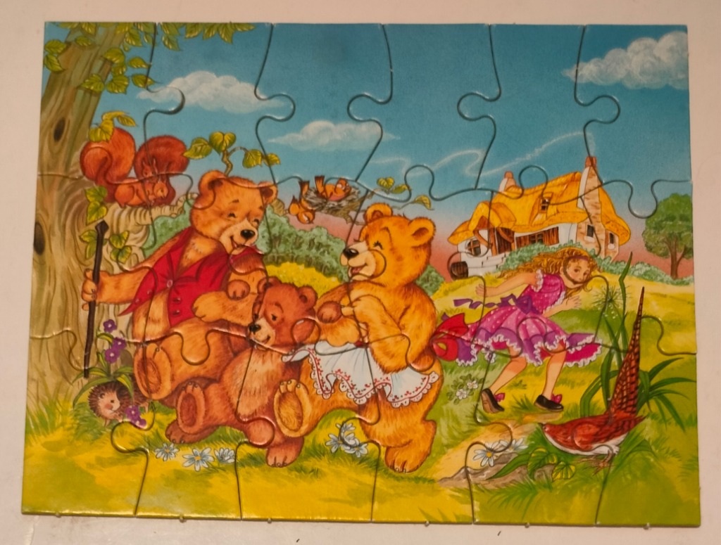 A whimsical illustration of three teddy bears and Goldilocks near a cottage in a forest clearing.