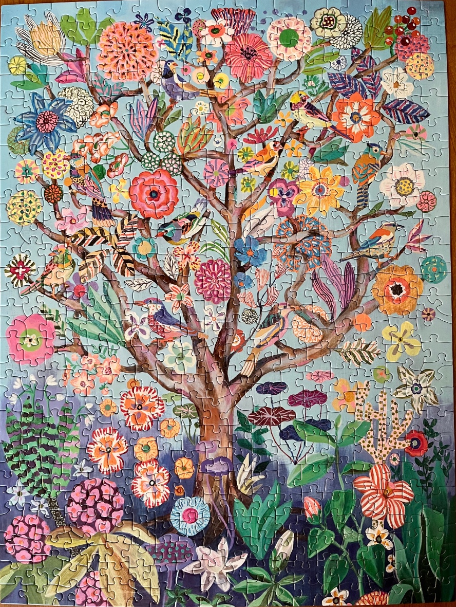 An illustration of a whimsical tree filled with colorful flowers and birds against a soft blue background.