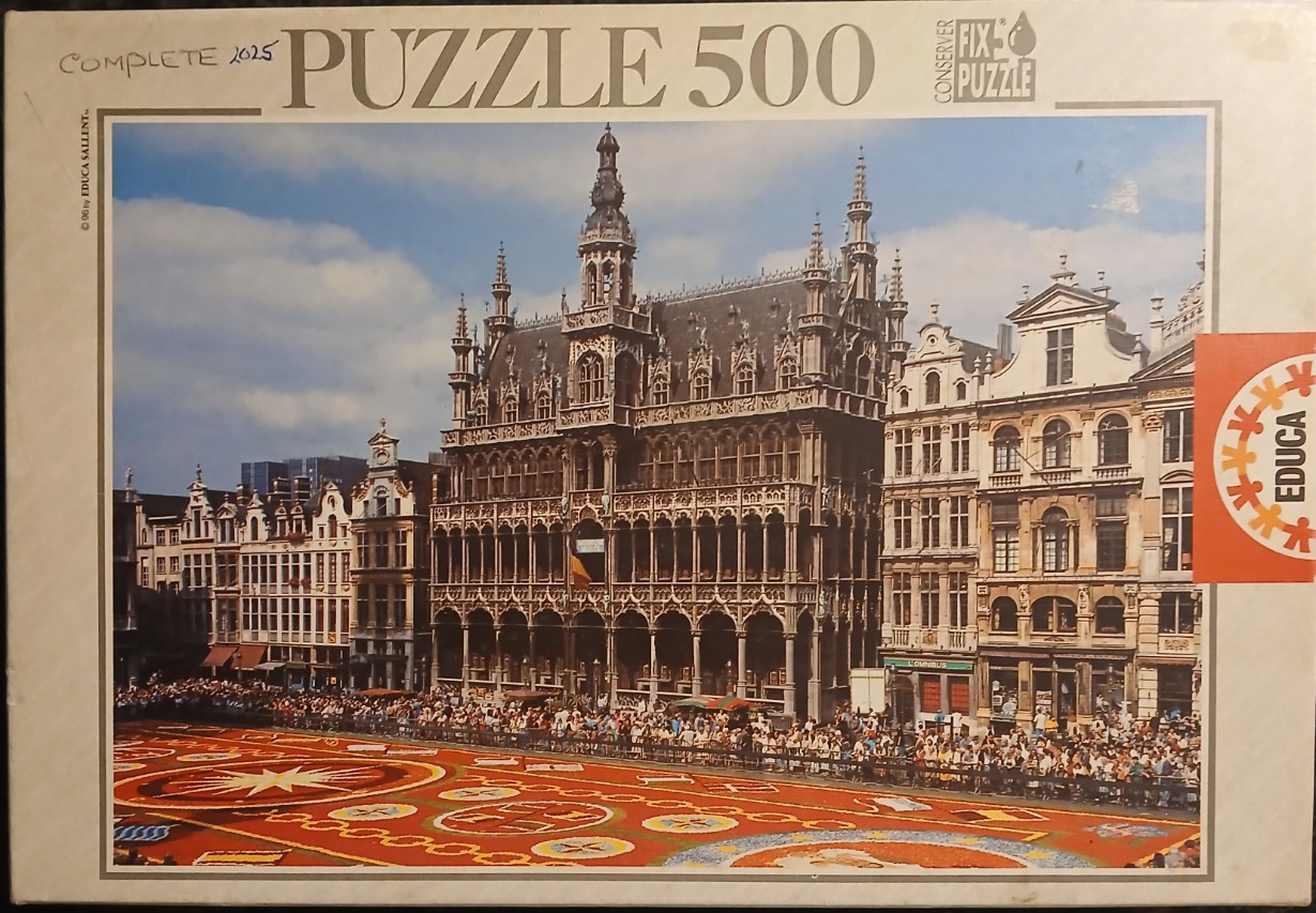 The Grand Place in Brussels with a vibrant flower carpet laid out in the town square.