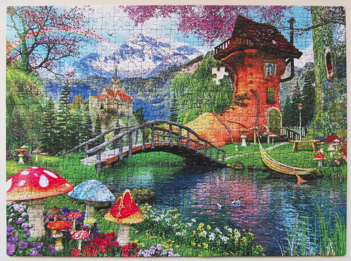 A fantasy illustration of a house shaped like a giant shoe by a pond with a castle and mountains in the background.