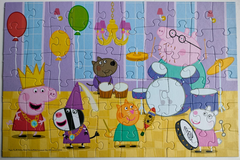 Cartoon characters from Peppa Pig playing instruments in a room decorated with balloons and a chandelier.