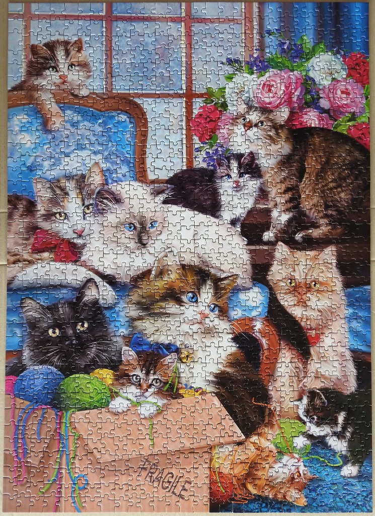 An illustration featuring a large group of fluffy kittens and cats playing with yarn in a cozy room.