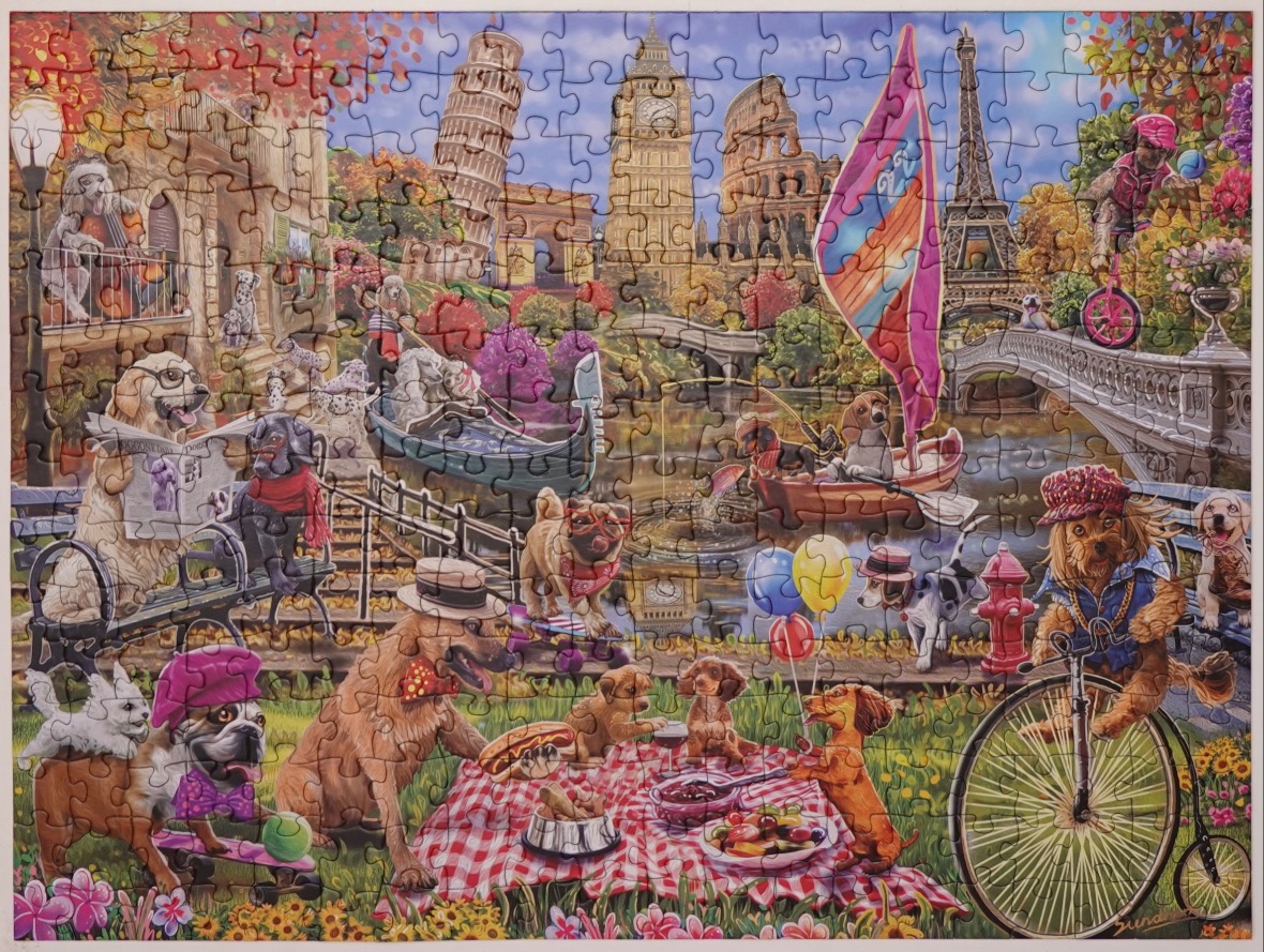 A whimsical illustration of many dogs enjoying a sunny day in a park featuring famous world landmarks.