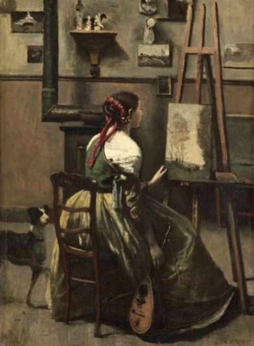 A woman in a period dress sitting in a studio before an easel with a dog nearby.