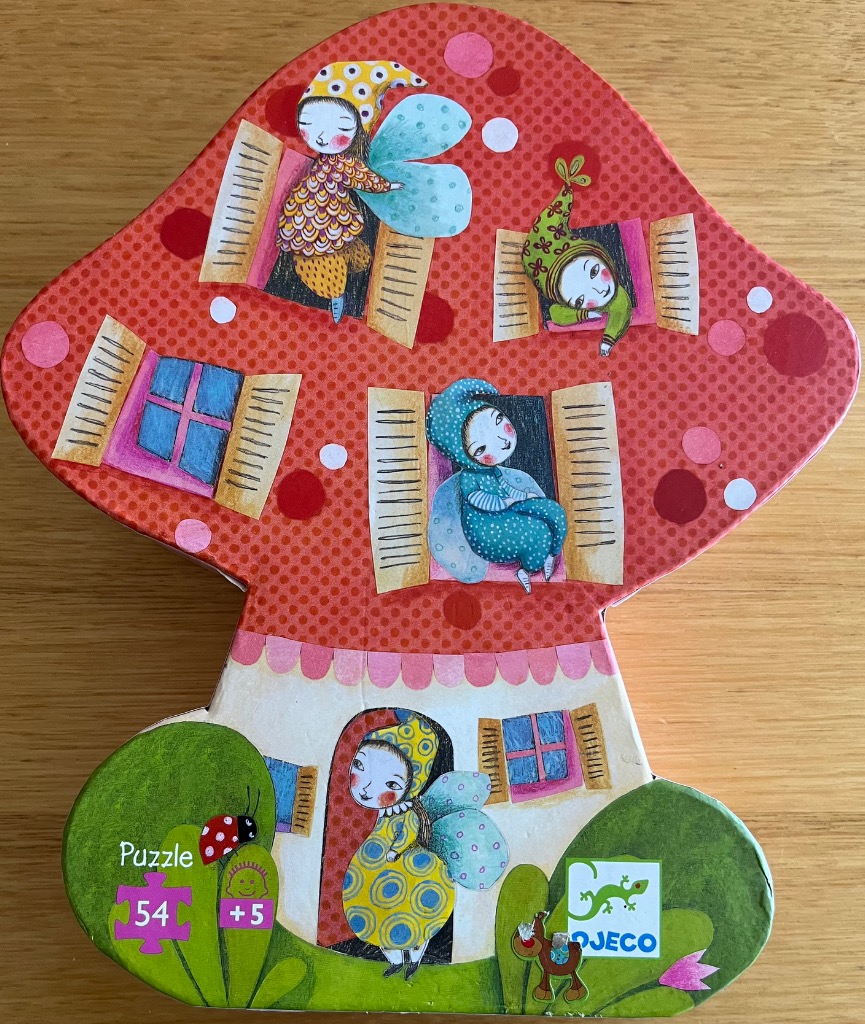 Whimsical mushroom-shaped fairy house illustration with five forest sprites in windows.