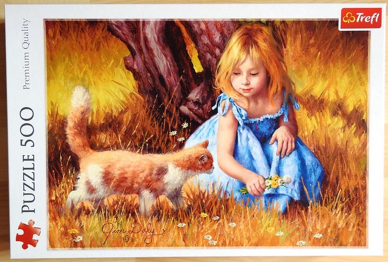 An oil painting of a young blonde girl in a blue dress sitting in a golden field with an orange cat.