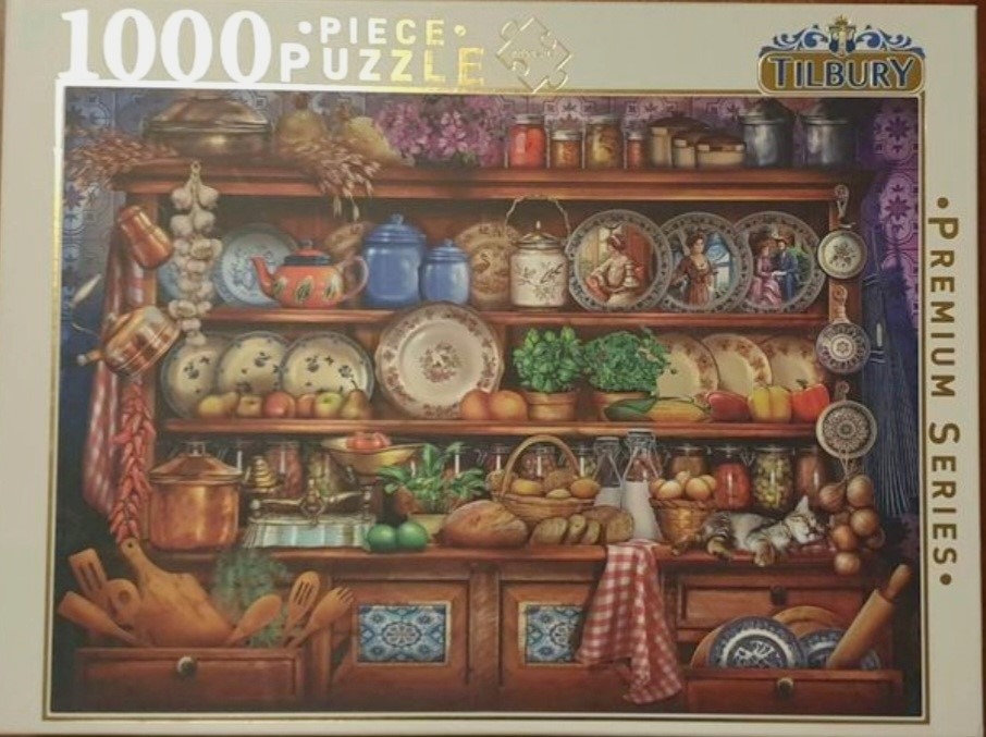 A cozy, rustic wooden kitchen hutch filled with ceramics, produce, and cooking supplies.