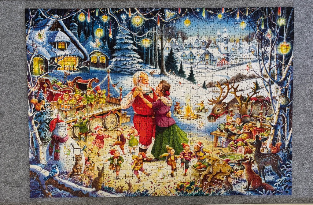 An illustration of Santa Claus and Mrs. Claus dancing at a snowy holiday celebration with elves and woodland animals.