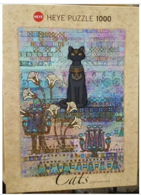An Egyptian-inspired illustration of a black cat wearing a golden collar against a patterned, colorful background.