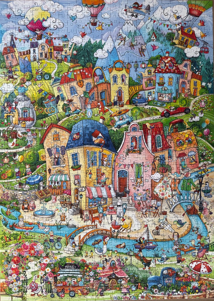 Cartoon illustration of a bustling, whimsical village with anthropomorphic animals and mountain scenery.
