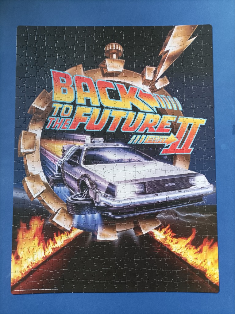 Back to the Future Part II movie poster illustration featuring the DeLorean time machine.
