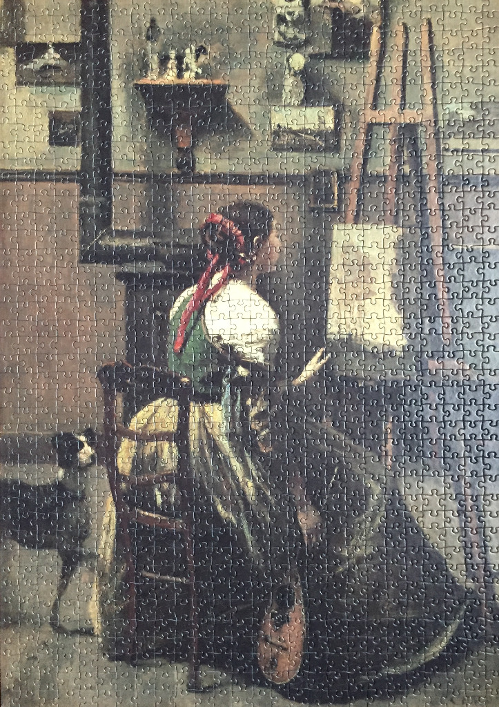 A woman in period dress sits in an artist studio before an easel with a dog standing beside her.