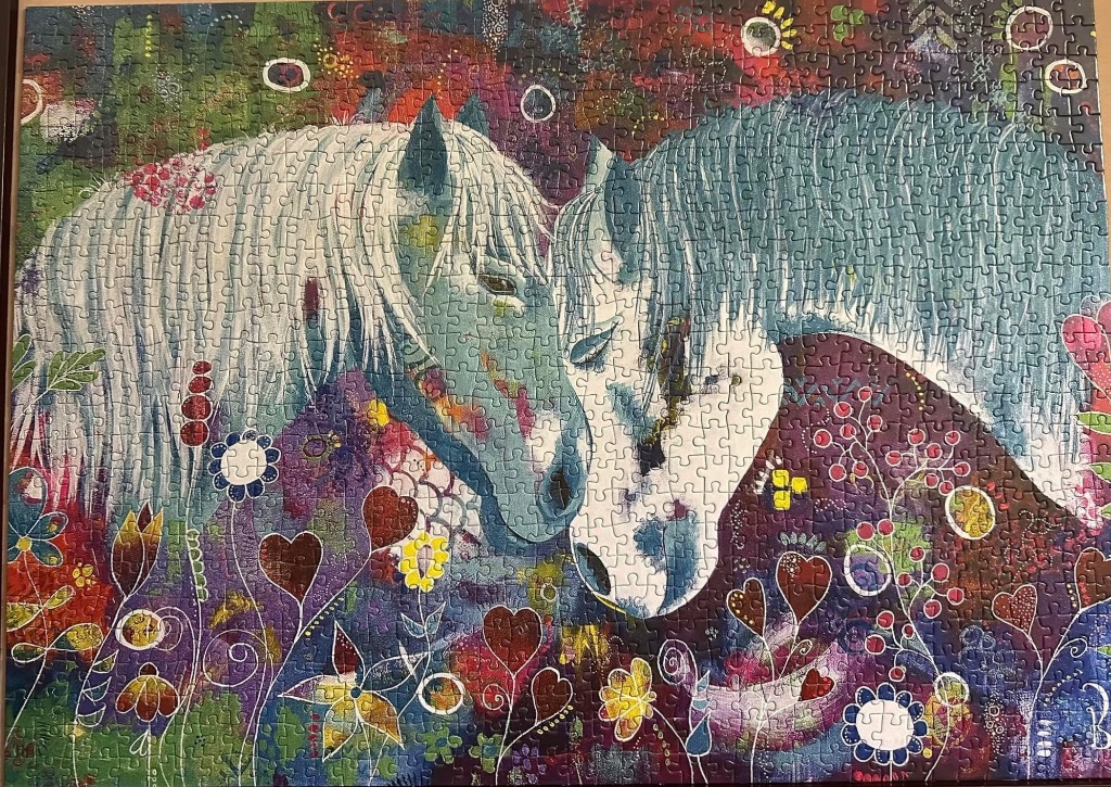 Artistic illustration of two white horses nuzzling in a vibrant, patterned landscape filled with hearts and flowers.
