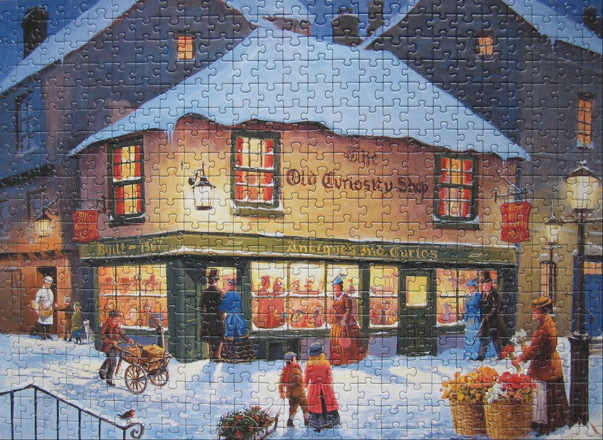 A Victorian-era scene of The Old Curiosity Shop covered in snow at night.