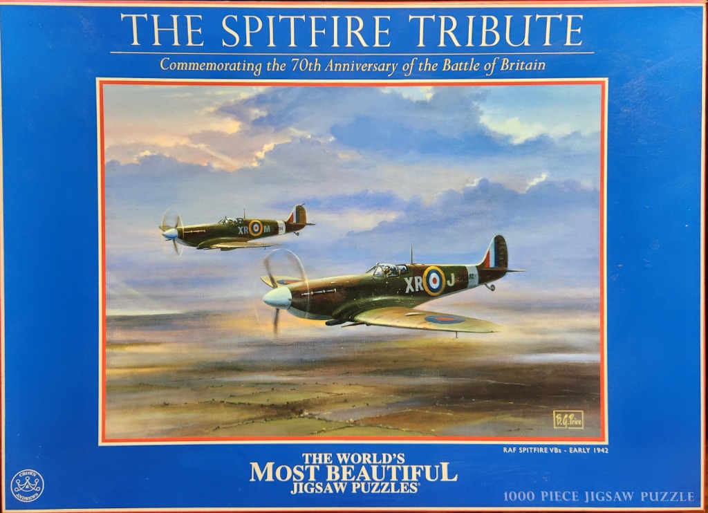 Painting of two Supermarine Spitfire aircraft flying over a rural landscape at sunset.