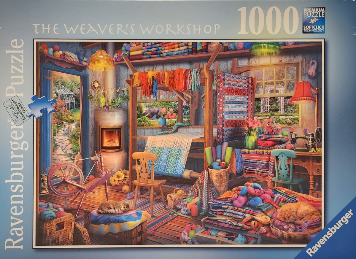 A cozy, vibrant weaver's workshop filled with looms, yarn, and two sleeping cats.