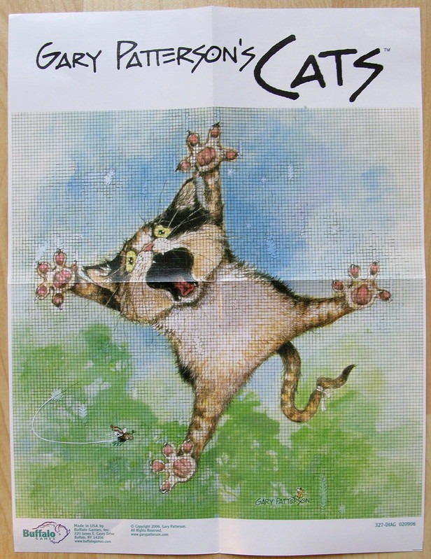 Illustration of a startled calico cat spread-eagled in mid-air against a light blue and green background.