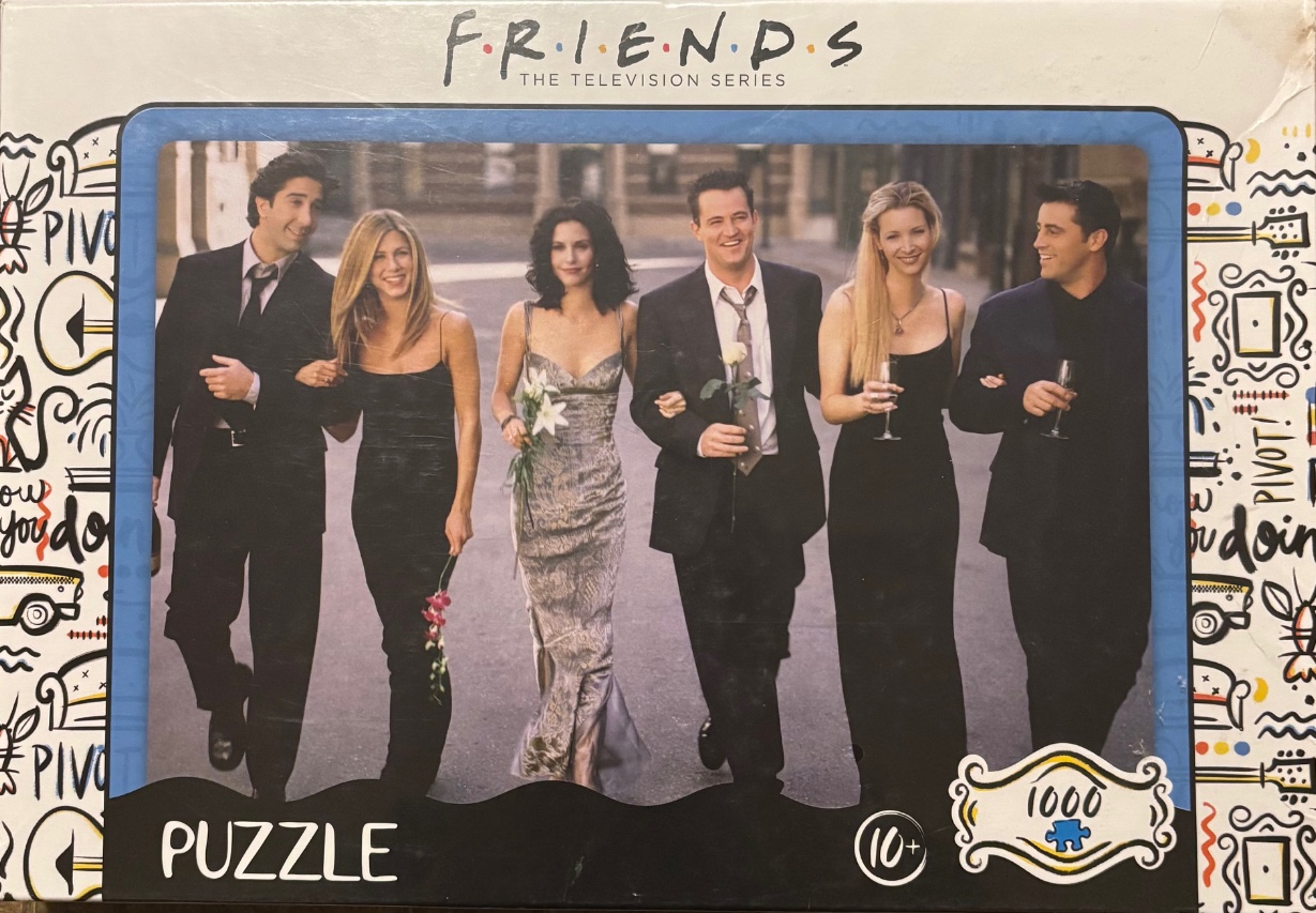 A group portrait of six friends walking in formal wear on a city street.