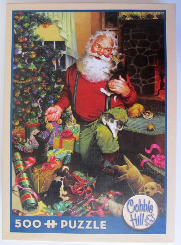 Santa Claus surrounded by playful kittens and puppies in front of a decorated Christmas tree.