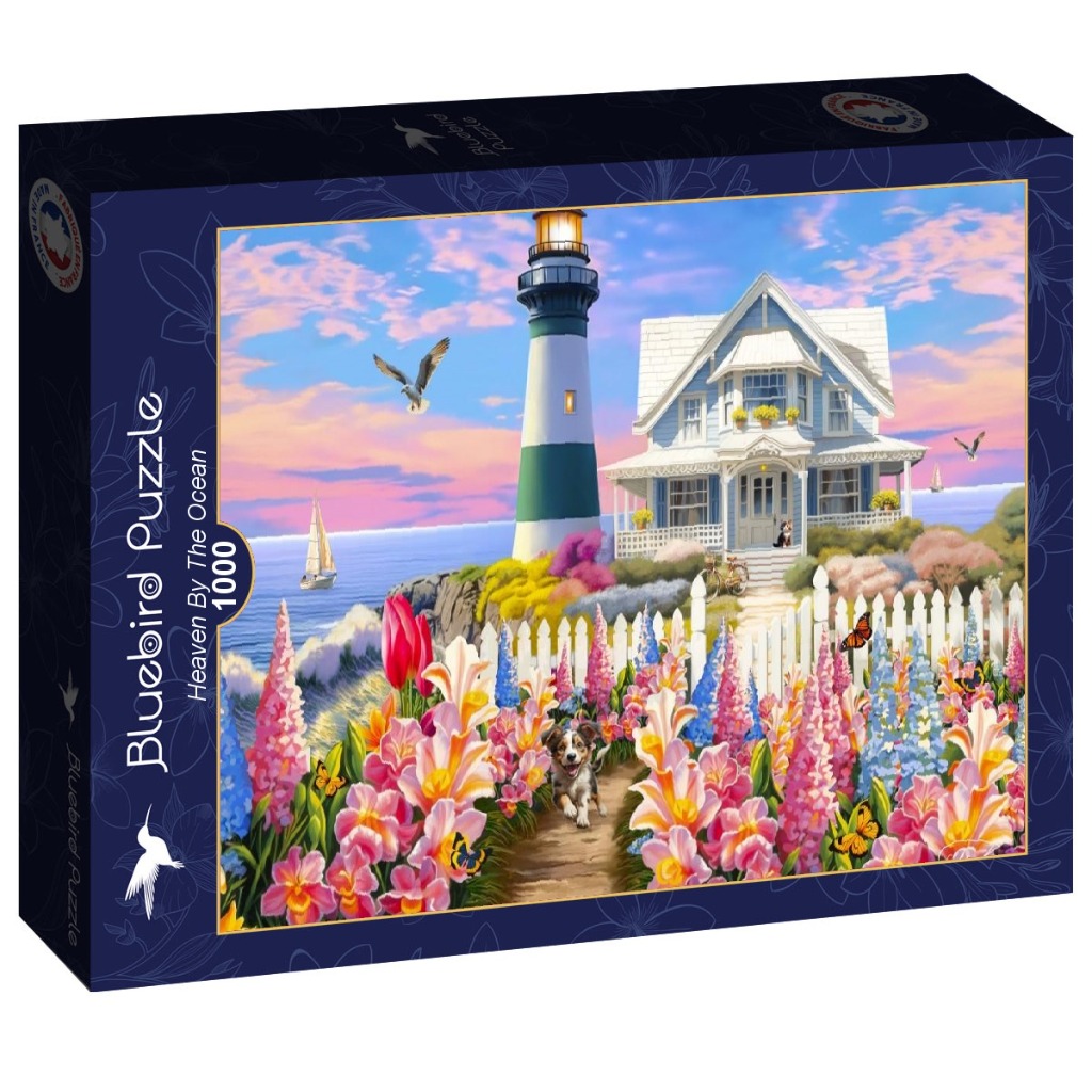 A lighthouse and blue coastal cottage surrounded by a vibrant flower garden with an Australian Shepherd walking on a path.