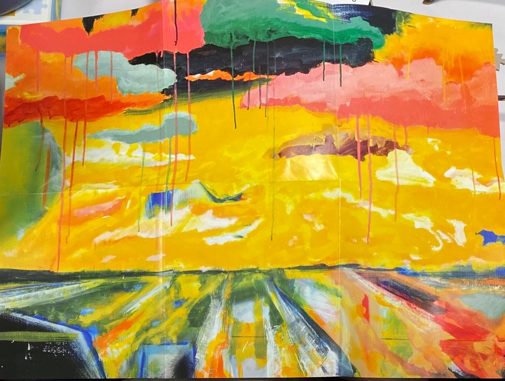 Abstract painting with a vibrant yellow sky dripping with paint over a textured, colorful landscape.