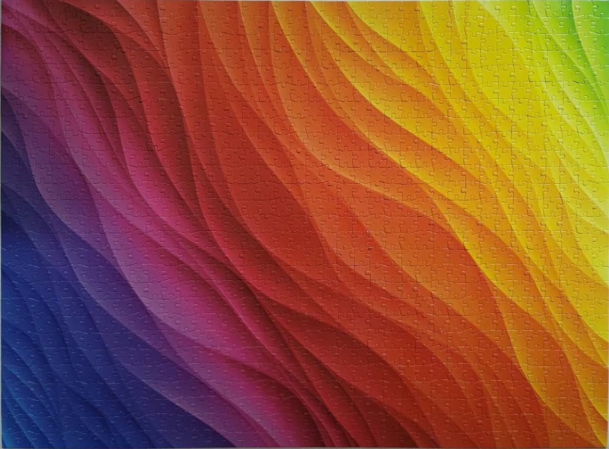 An abstract pattern of sweeping, multi-coloured gradient waves in a spectrum of blue, purple, red, orange, and yellow.