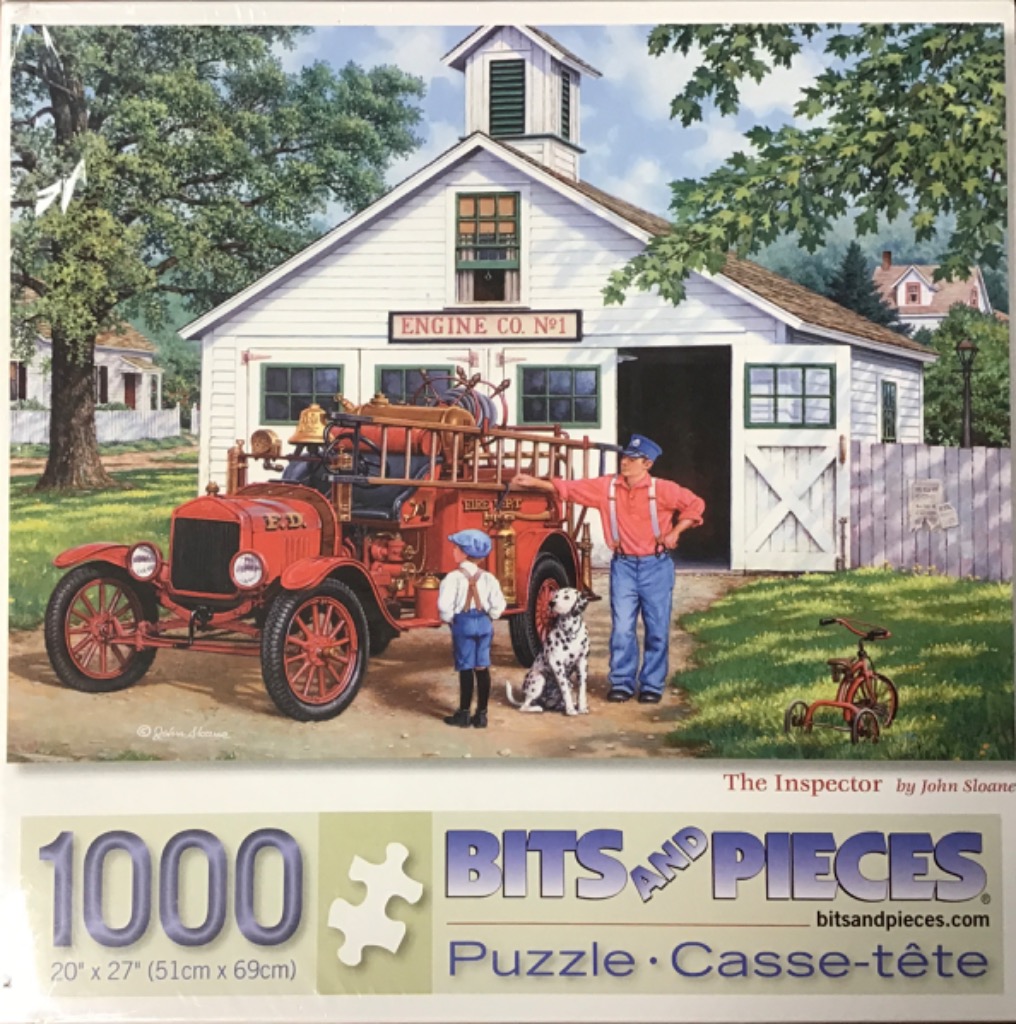 A vintage fire truck parked outside a white wooden fire station with a man, boy, and a Dalmatian.