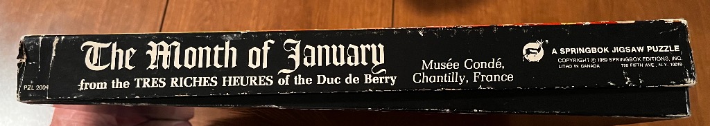 Box for "The Month of January" featuring antique script and a deer graphic.