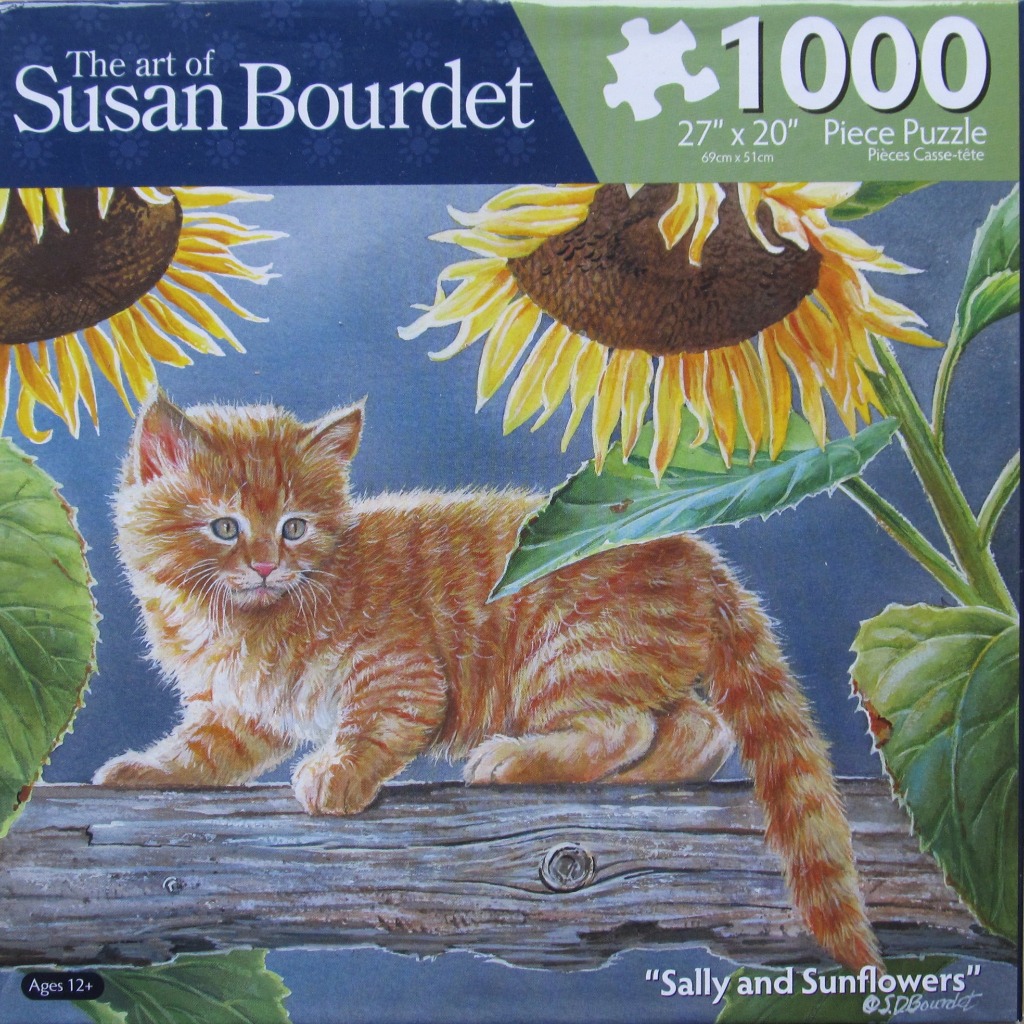 An orange tabby kitten perched on a weathered wooden log surrounded by large sunflowers against a deep blue background.