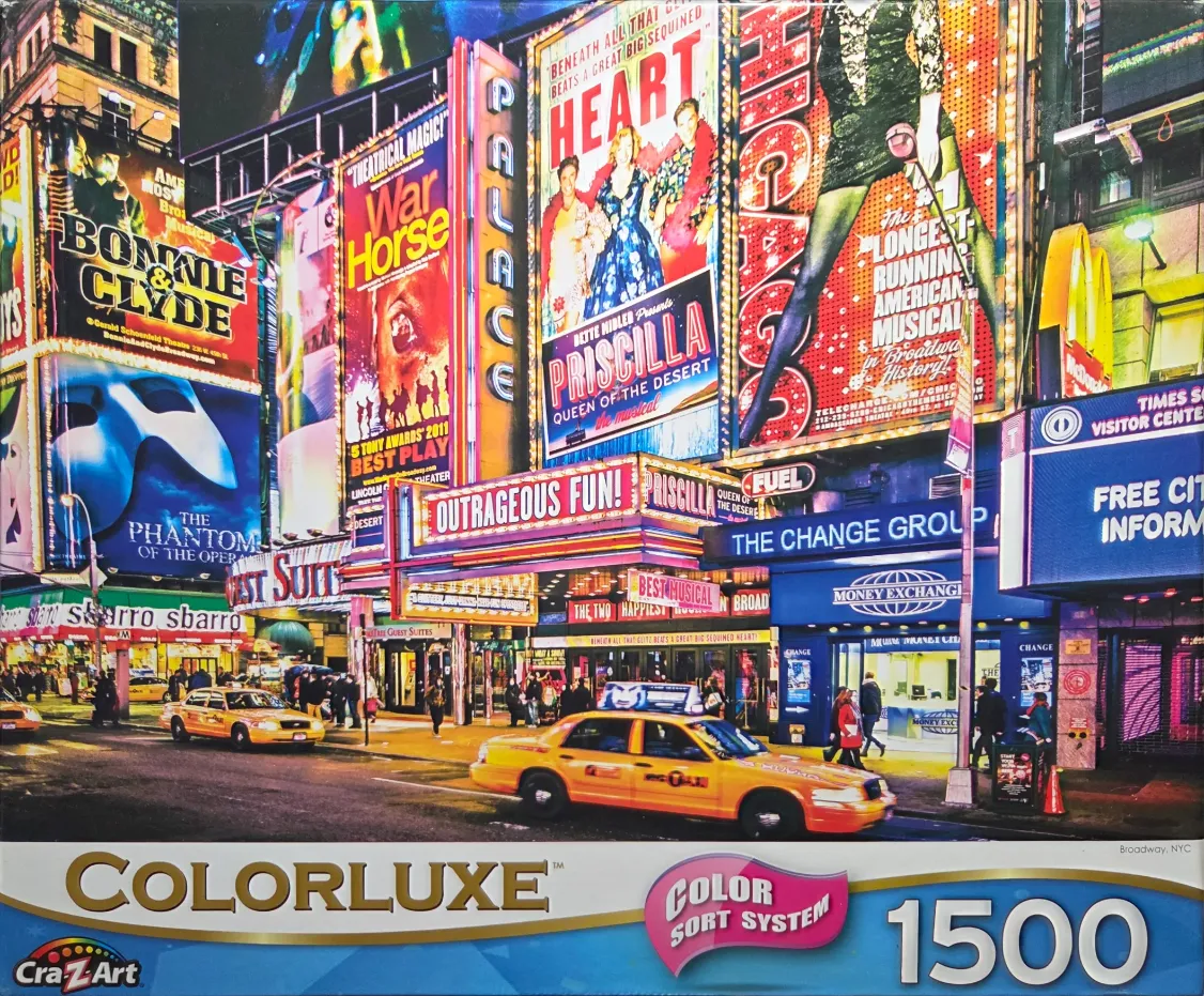 A vibrant night-time street scene of Times Square in New York City with bright Broadway theater marquees and yellow taxis.