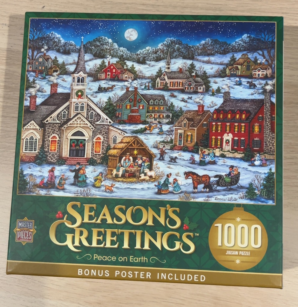 A moonlit winter village scene featuring a church, a nativity display, and horse-drawn sleighs in the snow.