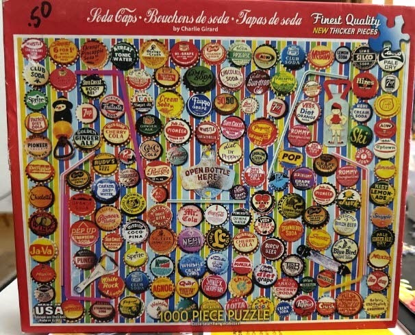A collage of vintage soda bottle caps arranged on a colorful striped background.