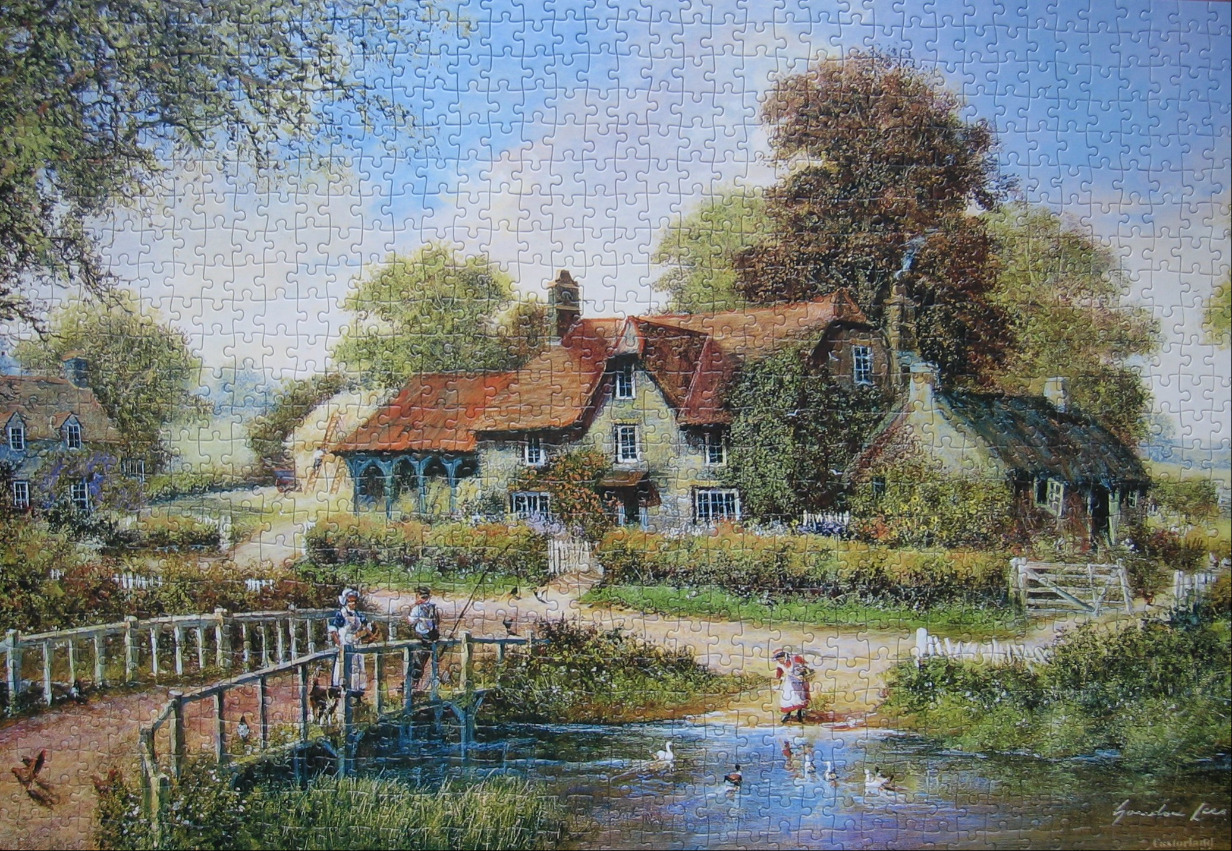 A peaceful English countryside scene featuring an old cottage, a wooden footbridge, and a quiet pond.