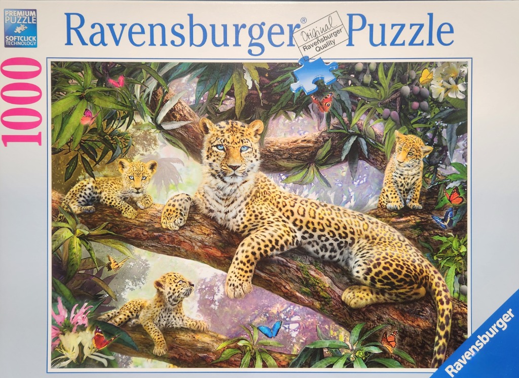 A mother leopard resting on a thick tree branch with three playful cubs in a lush jungle setting.