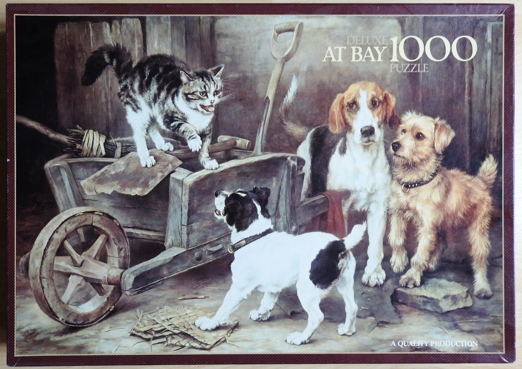 A tabby cat arching its back at three dogs around a wooden wheelbarrow in a rustic barn setting.