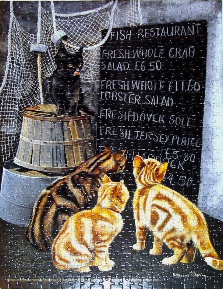 Three cats looking at a black restaurant chalkboard menu near a wooden barrel and fishing net.