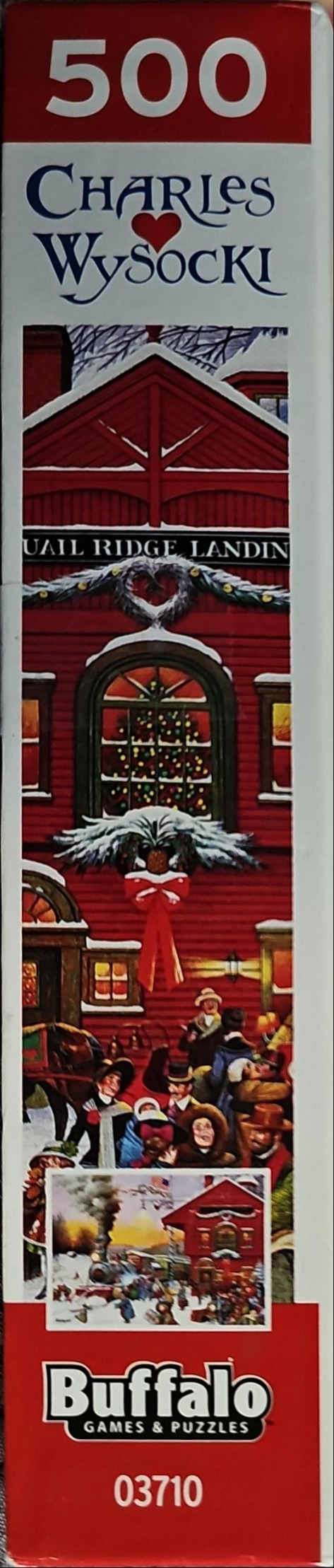 Winter holiday scene with a red building and townspeople gathered at a train station.