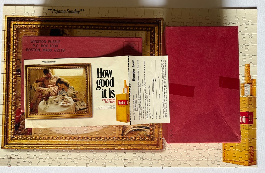 A collection of vintage advertising items, including a rectangular jigsaw puzzle, a mail-in form, and a red box.