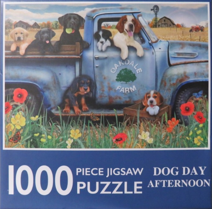Seven puppies of various breeds sitting in and around a rustic blue pickup truck on a farm.