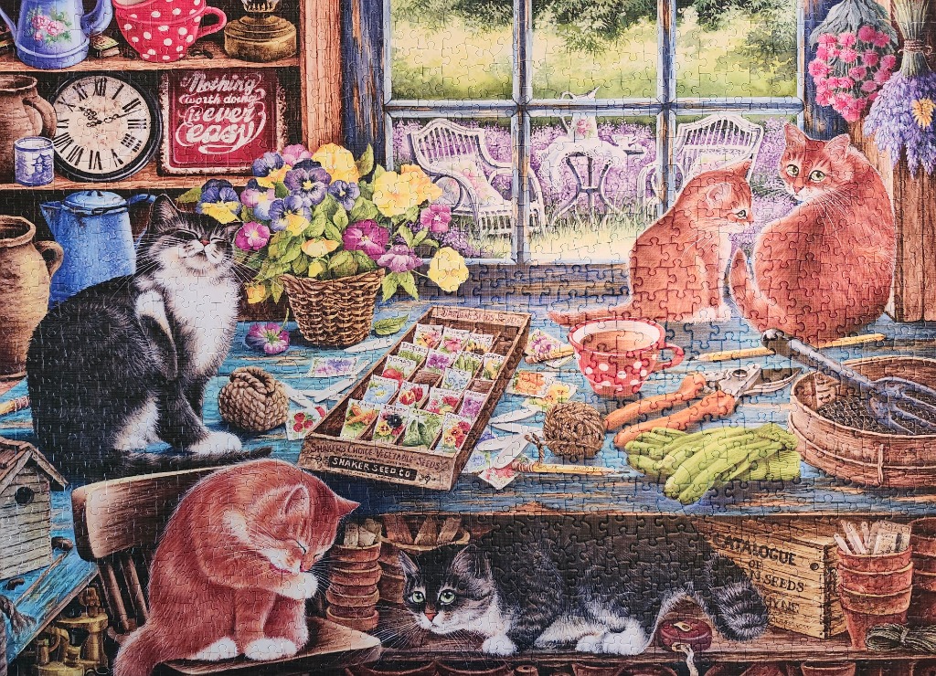 Four cats lounging in a cozy, sunlit garden potting shed filled with plants, seeds, and gardening tools.
