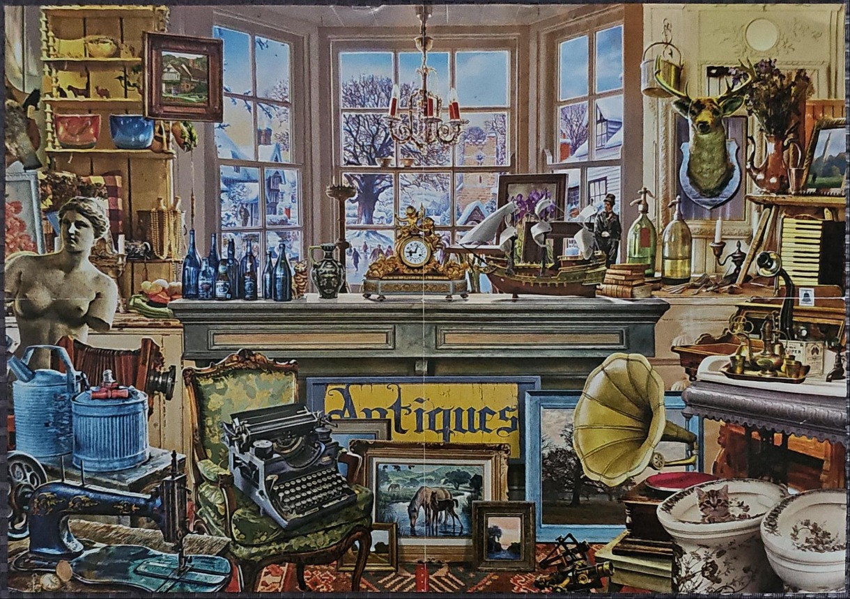 A cluttered antique shop interior overlooking a snowy winter village scene outside a bay window.