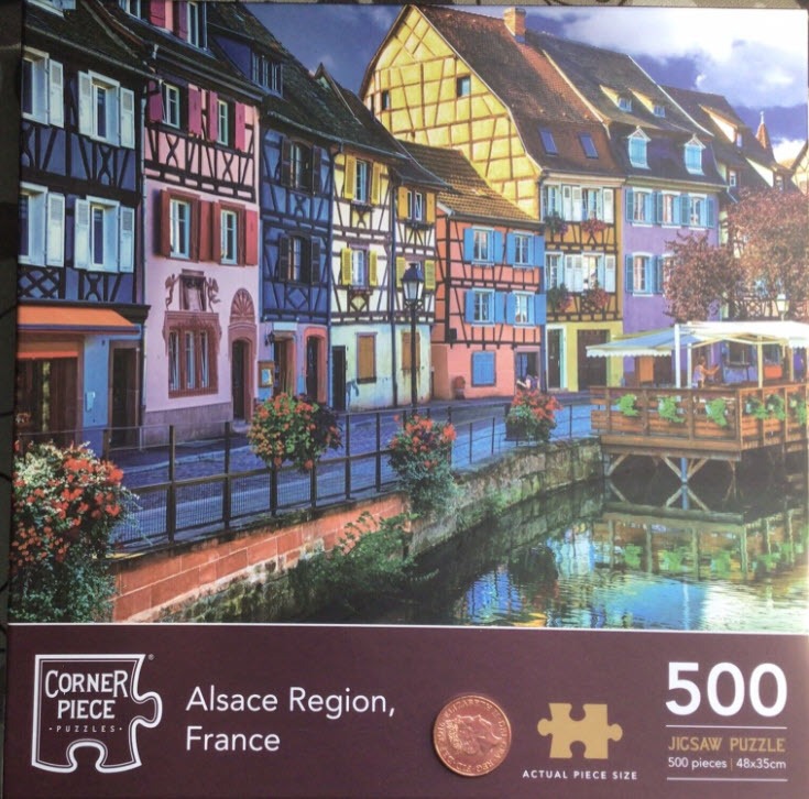 Colorful half-timbered houses along a canal in the Alsace region of France