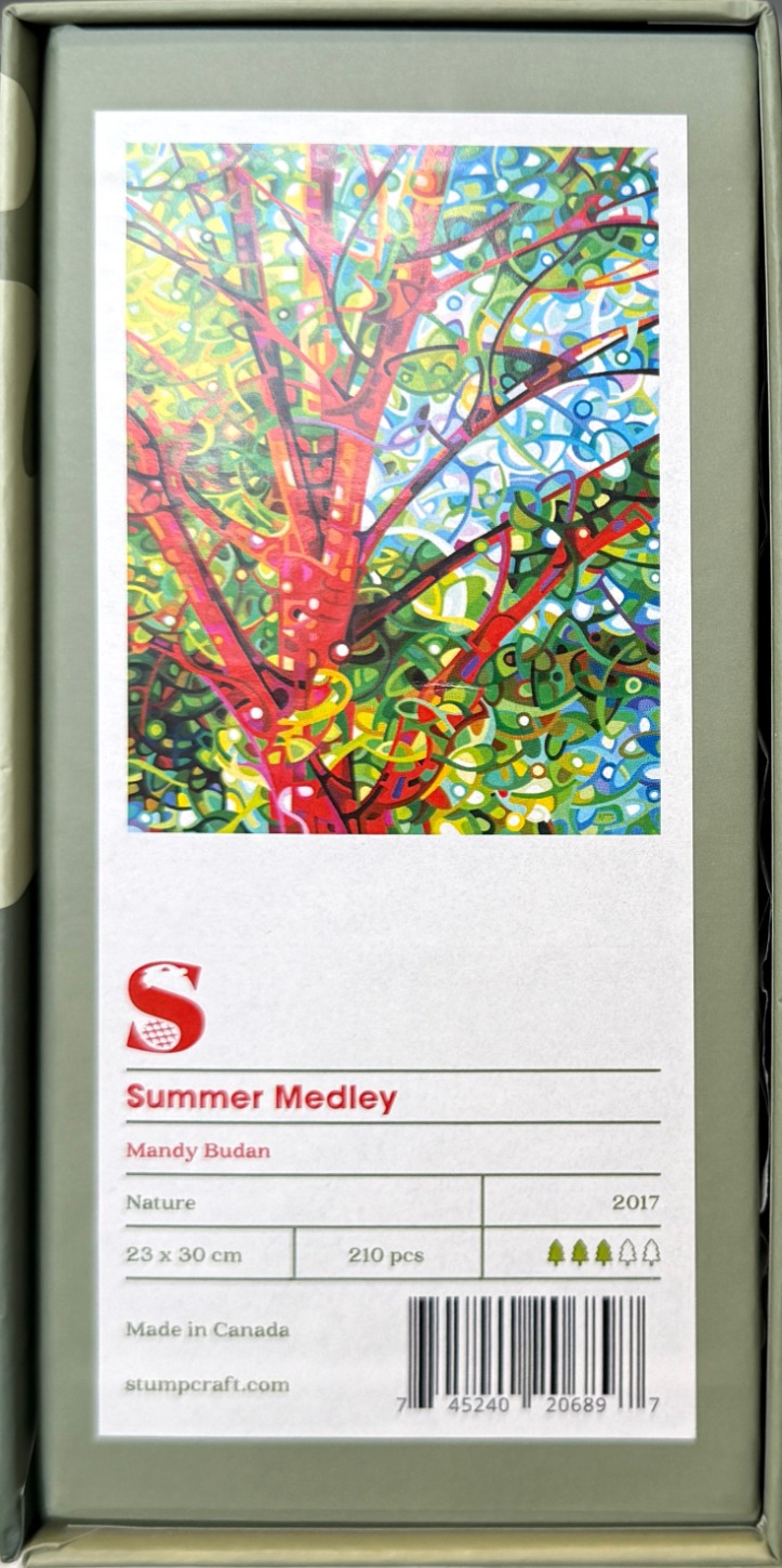 A vibrant, abstract painting of a tree with swirling, colorful branches and leaves in red, blue, green, and yellow.