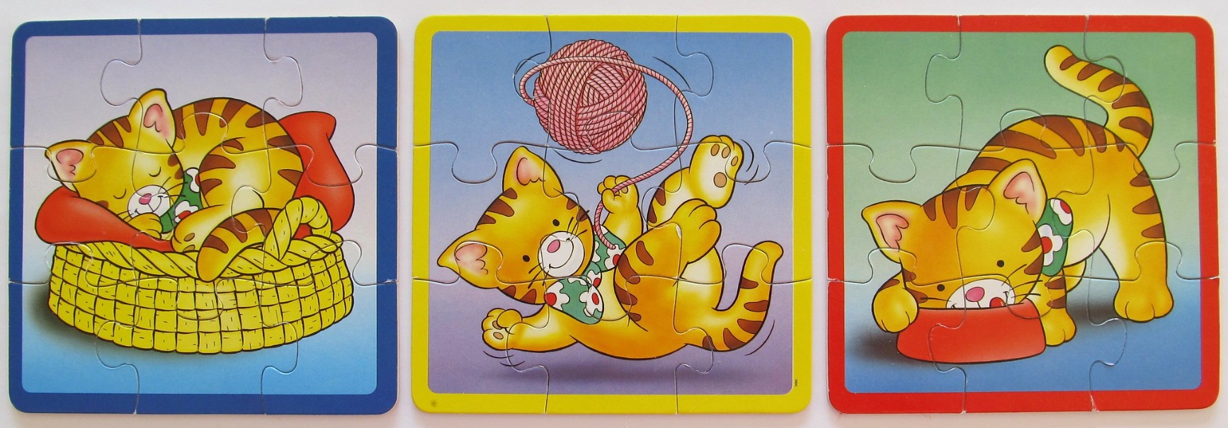 Three illustrations of a cartoon tabby kitten playing, sleeping, and eating, each framed by a different coloured border.